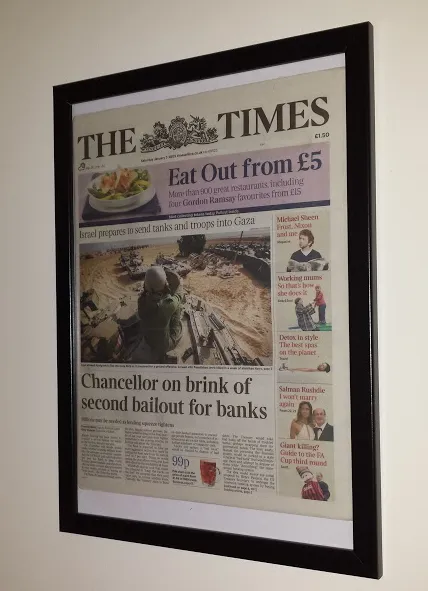 A framed The Times newspaper with the now-famous “Chancellor on brink of second bailout for banks” headline