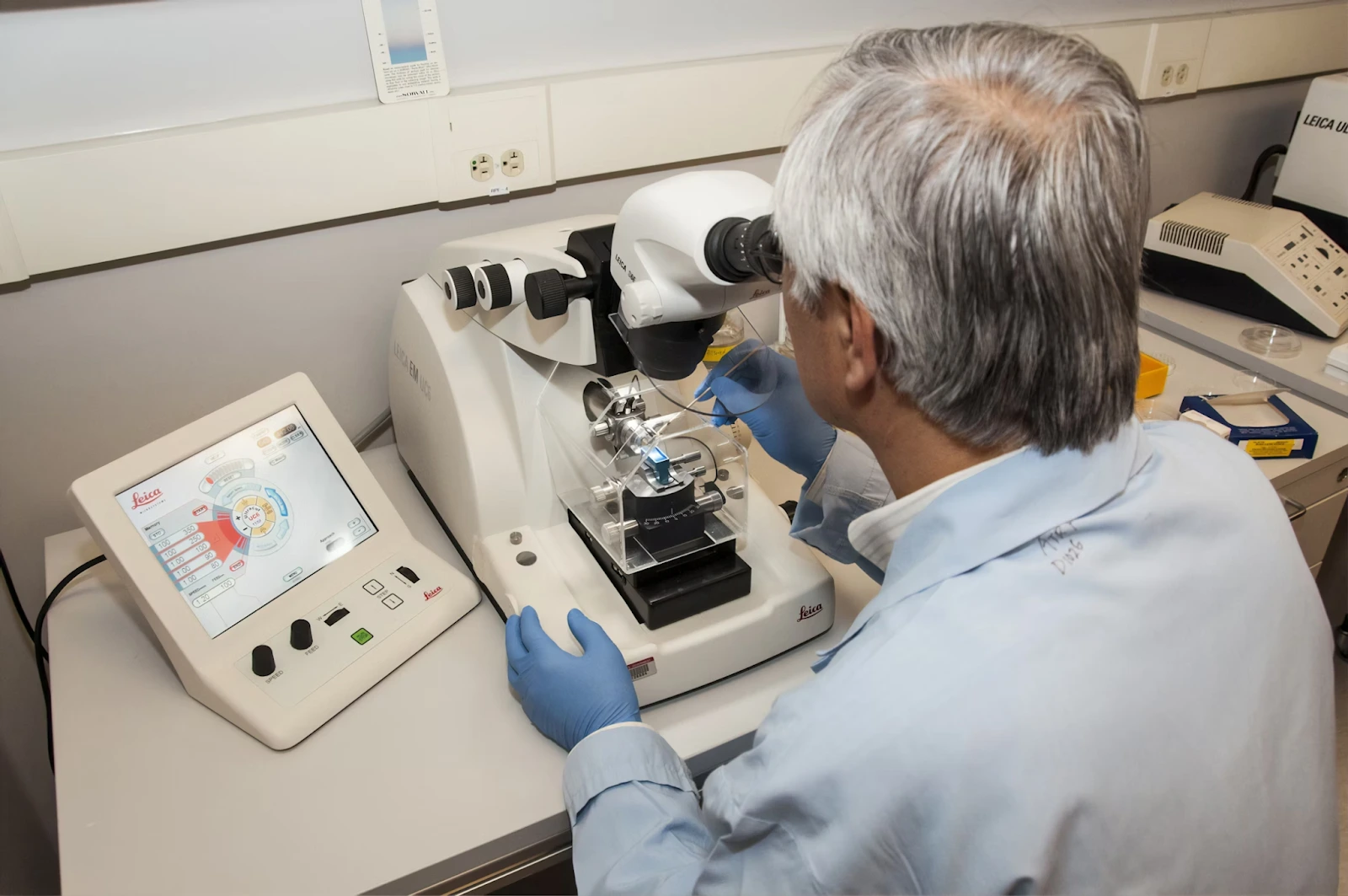 A technician using a microtome at the Advanced Technology Research Facility (ATRF)