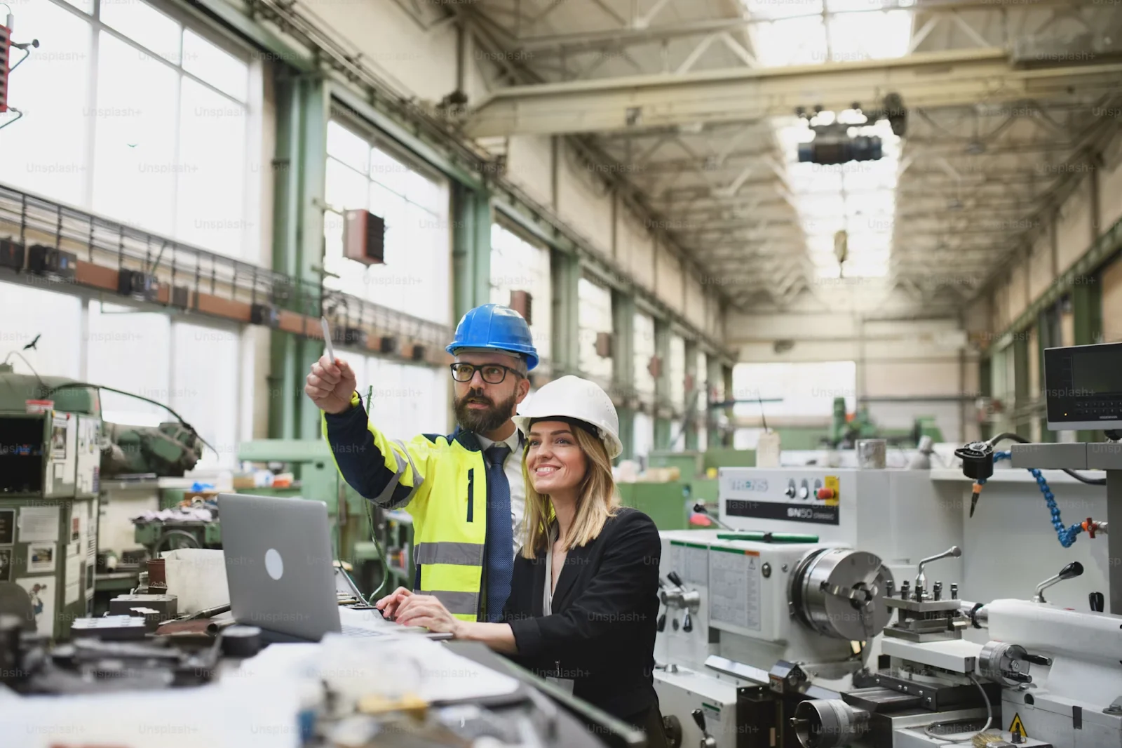 Two supply chain professionals planning the layout for sensor integration